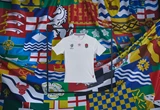 umbro-england-rugby-23-24-home-jersey-held-up