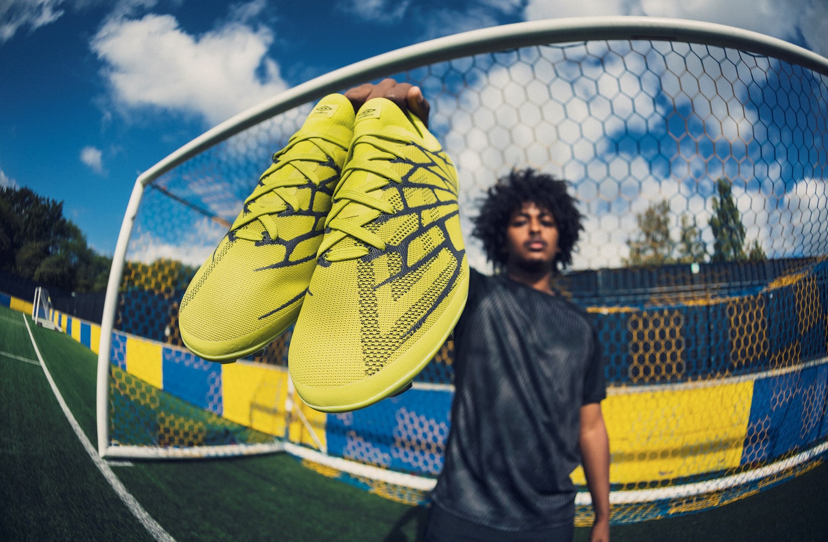 umbro-velocita-alchemist-mo-omar-holding-boots