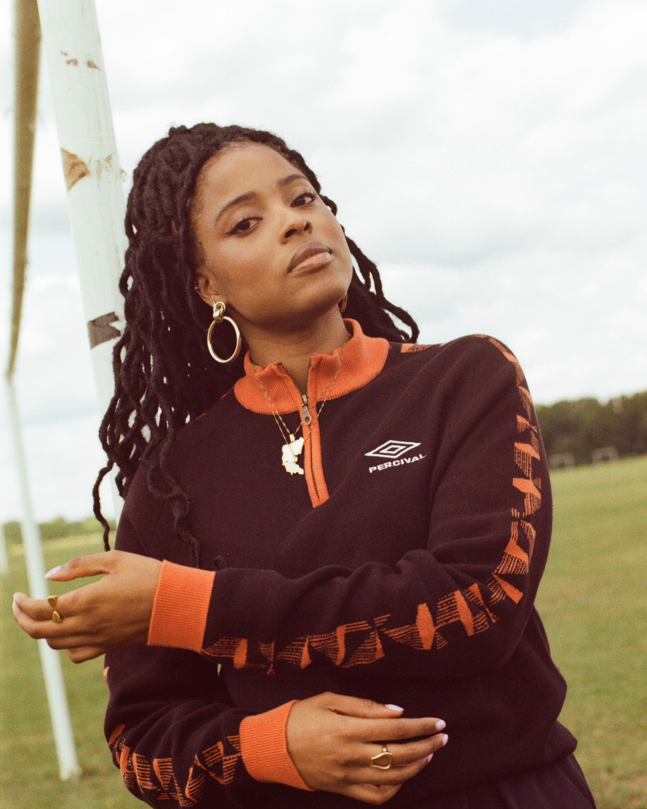 percival-x-umbro-female-model-wearing-zip-up-top