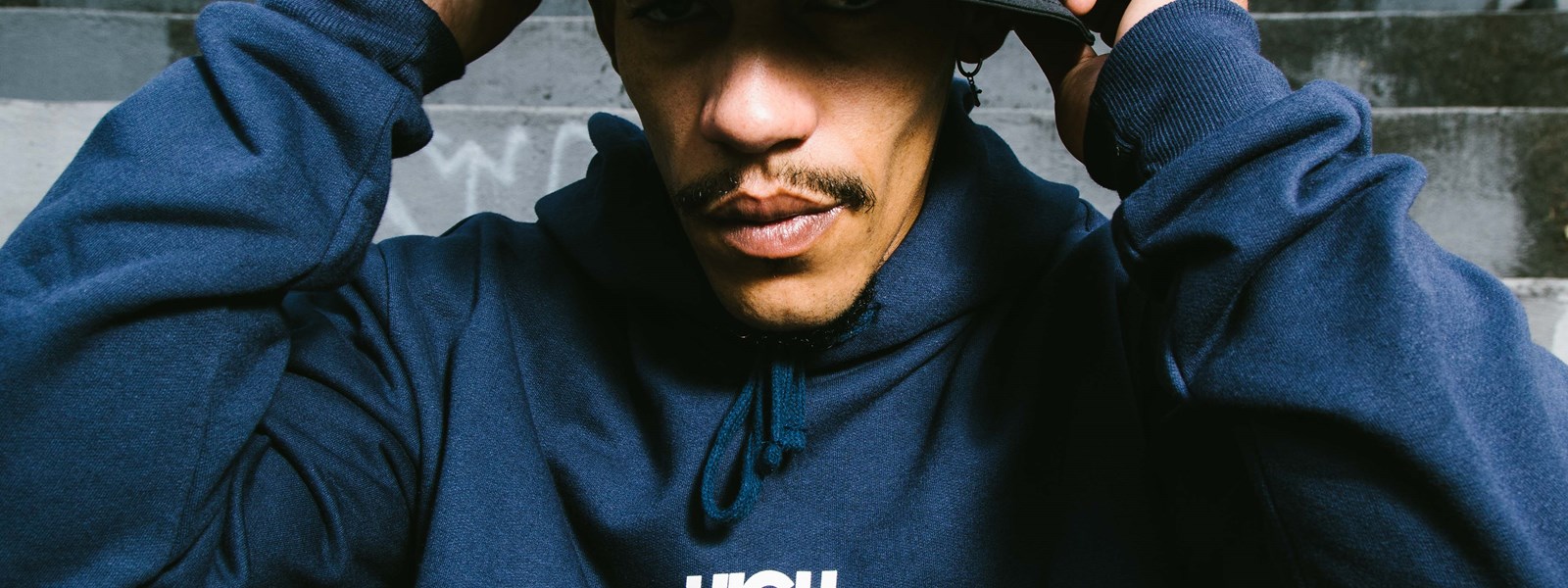 high-x-umbro-model-in-bucket-hat-and-hoodie