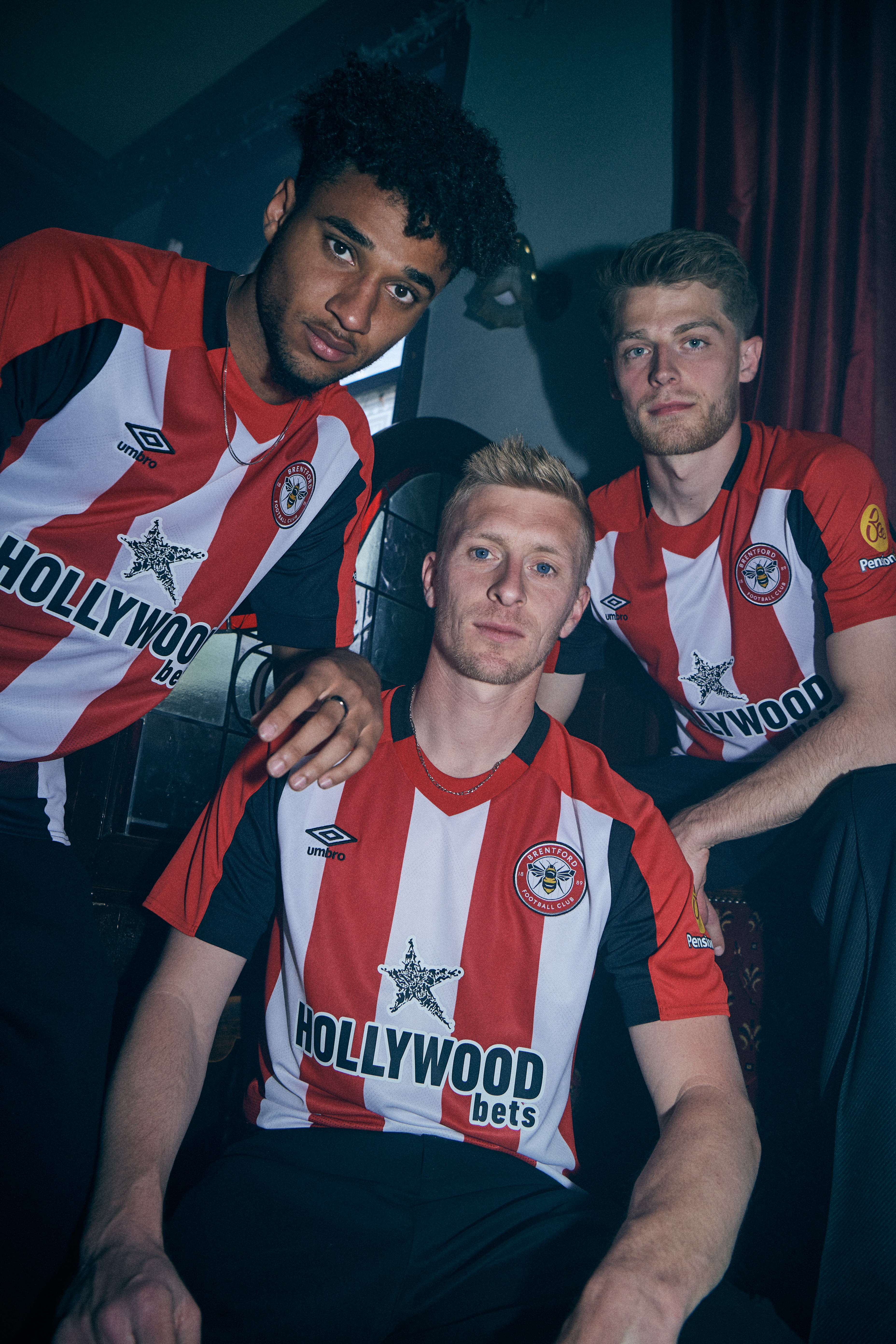 umbro-brentford-23-24-home-jersey-front-three-players