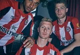umbro-brentford-23-24-home-jersey-front-three-players