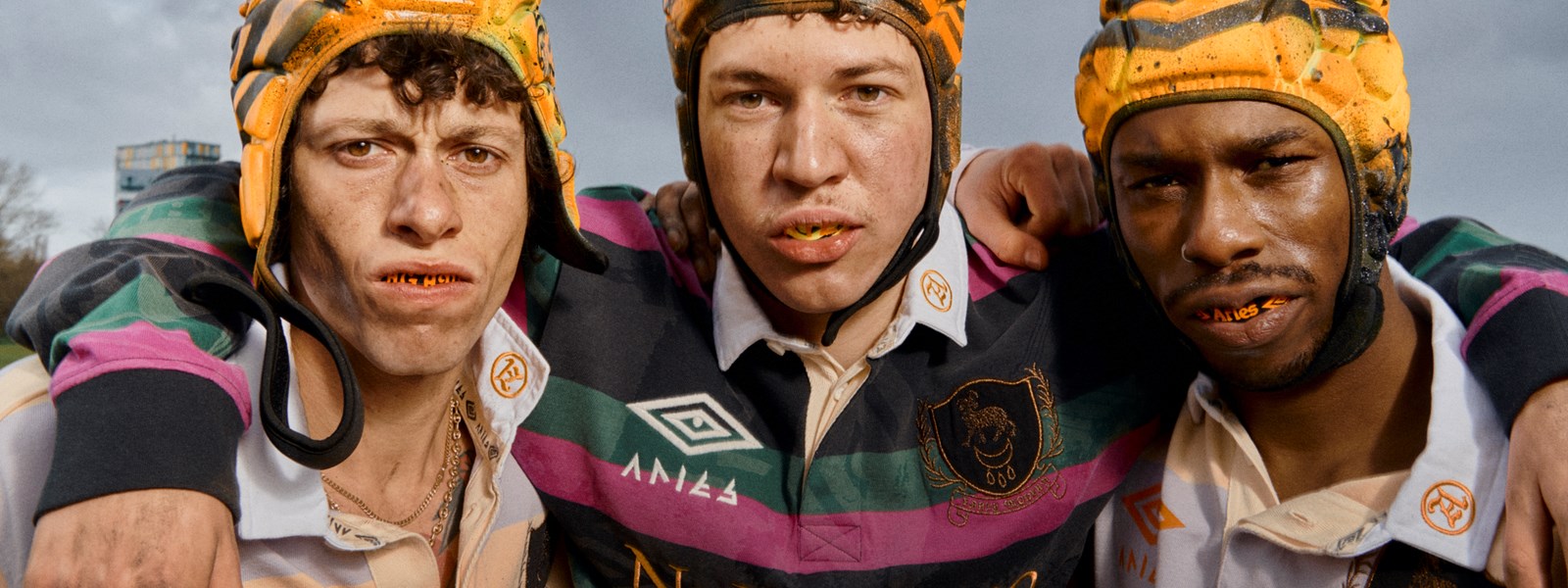 aries-x-umbro-rugby-players-huddled-together