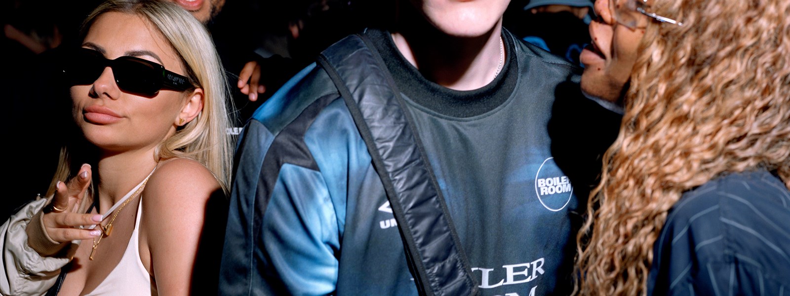 boiler-room-x-umbro-male-model-wearing-navy-football-jersey-and-bag