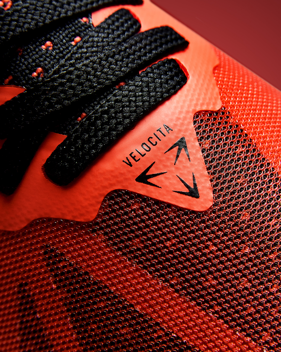 velocita-pro-cherry-tomato-black-silo-logo-shot