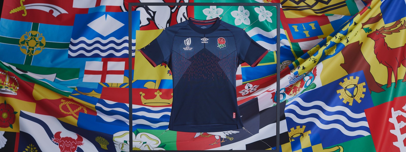 umbro-england-rugby-23-24-alternate-jersey-held-up