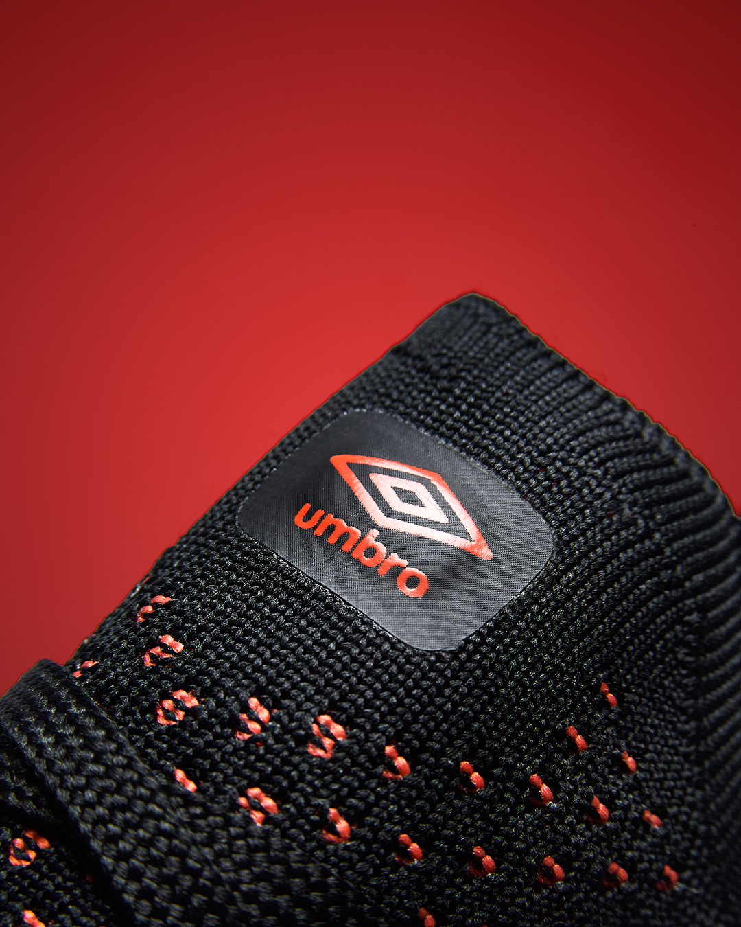 velocita-pro-cherry-tomato-black-umbro-logo-shot