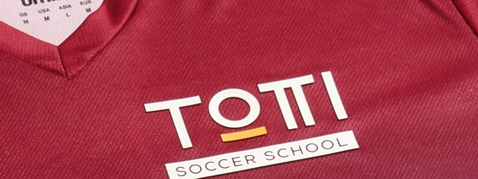 Totti-soccer-school-kits-home-crest
