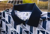 Hanon-umbro-silver-city-jersey-folded-over-rail