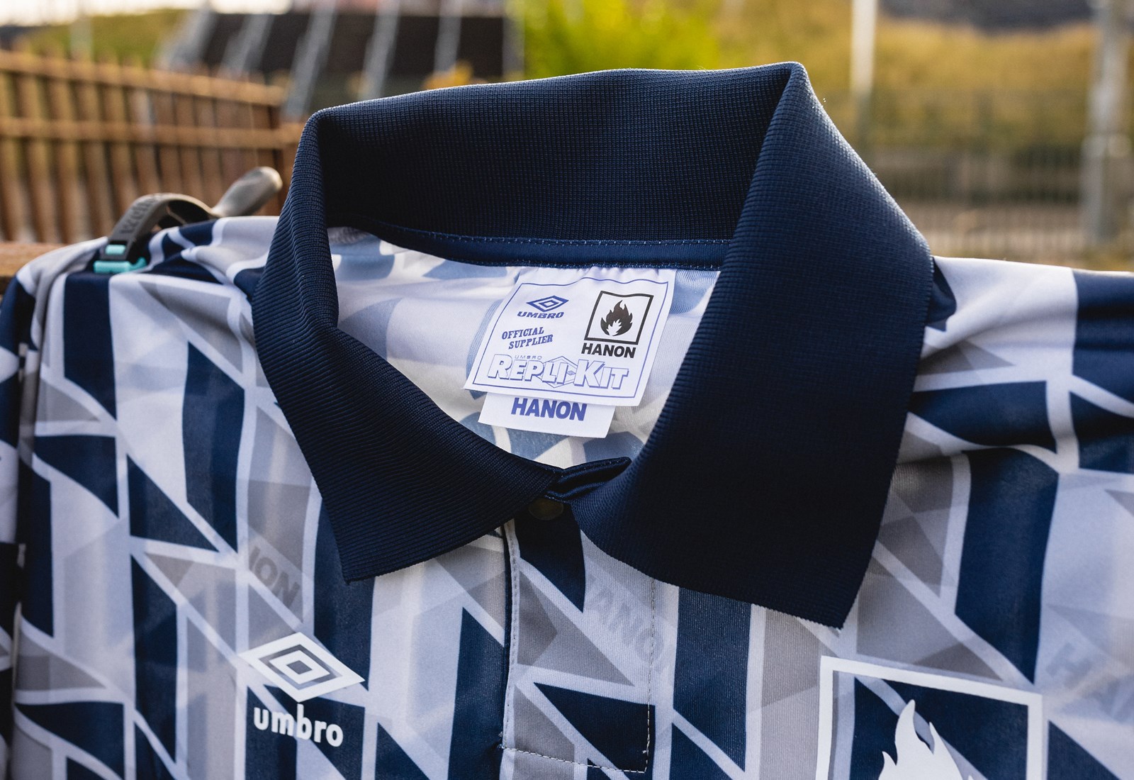 Hanon-umbro-silver-city-jersey-folded-over-rail