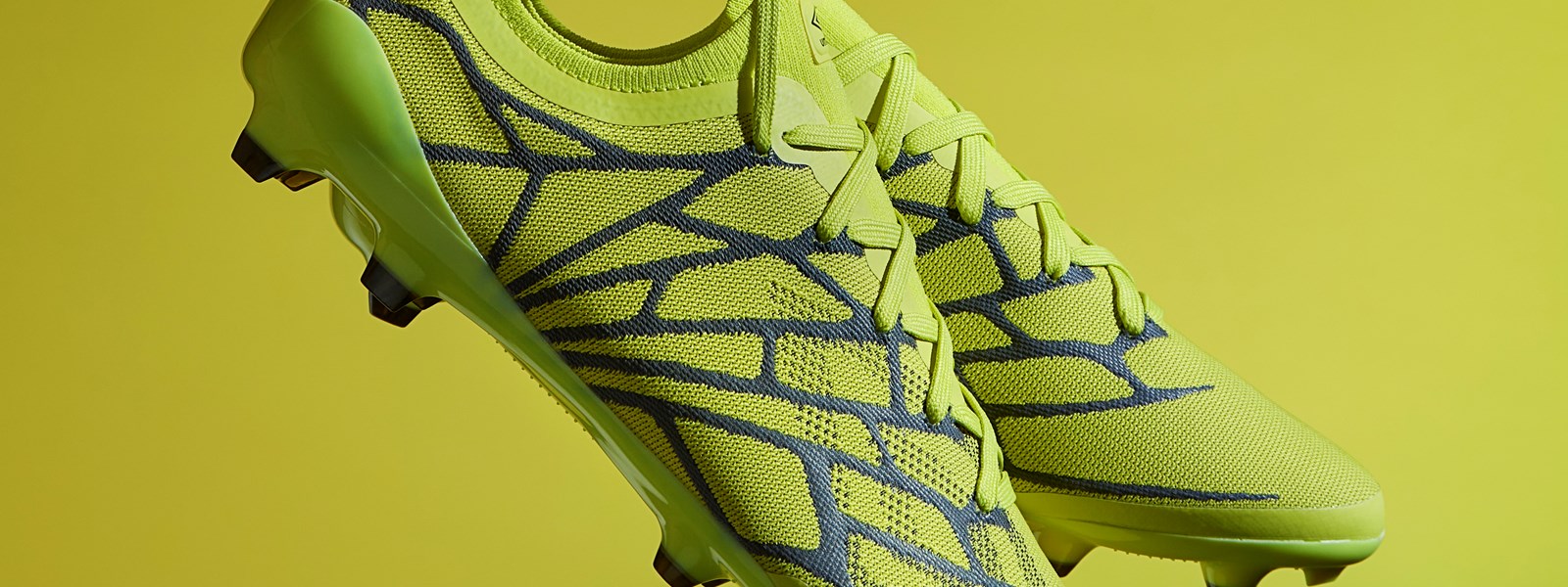 umbro-velocita-alchemist-studio-holding-boots